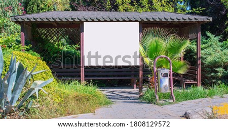 wooden shelter or bus stop with empty signage with mockup place outside