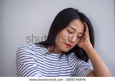 Young Asian women are sad and disappointed. Women have symptoms of depression. Sad and lonely concept