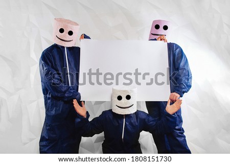 Three men in a suit of a marshmallow man on a white structural background hold a banner for your advertising. This is the best way to promote a company's brand. Interesting product advertisement.