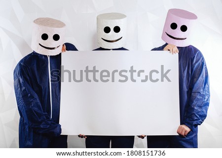 Interesting product advertising on a banner. Three men in a suit of a marshmallow man on a white structural background hold a banner for your advertising. 
