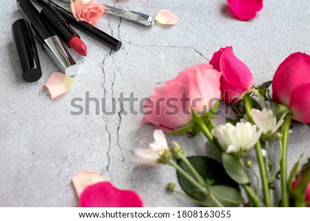 picture of beauty items, rose petals, cosmetics, beautiful flowers, mobile phone and space for text on the picture. 
Women's fashion. A stylish life. Makeup tools and pink flowers. 