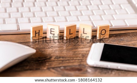 Letters on wooden pieces concept, business background, english word : Hello