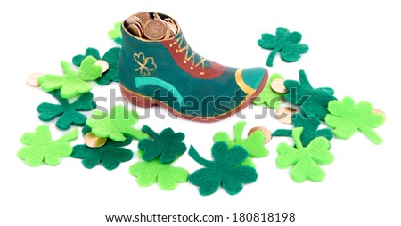 Saint Patrick day boot with gold and clover leaves, isolated on white