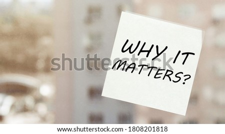 white paper with text Why It Matters on the window