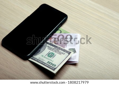 image of mobile phone money