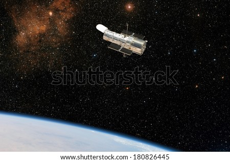 The Hubble Space Telescope observes deep space while in orbit above the Earth. Elements of this image furnished by NASA.  Royalty-Free Stock Photo #180826445