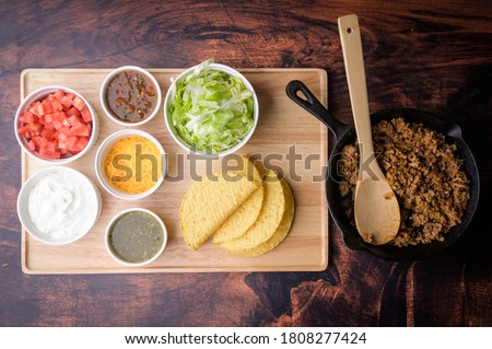 hard shell taco ingredients on wooden board