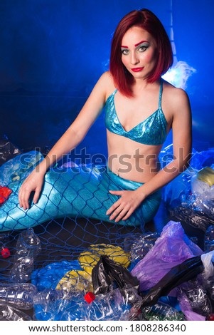 Sea plastic pollution concept. Mermaid in the ocean. Plastic is everywhere. Environmental protection.