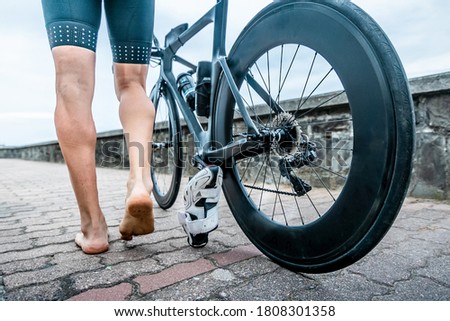 Man participating in triathlon with bicycle in mountain areaMan participating in triathlon with bicycle in mountain area Royalty-Free Stock Photo #1808301358