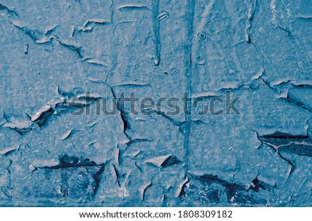Texture of old blue rusty painted metal wall with smudges closeup