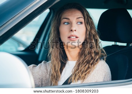 Pretty woman driving car stock photo
