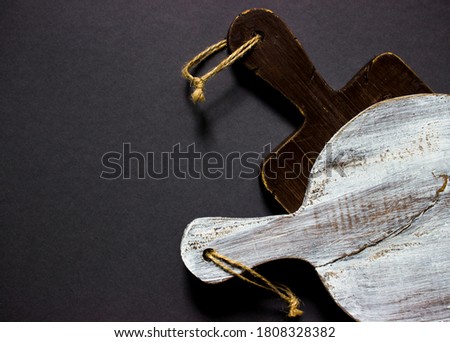 Wooden cutting boards on a gray background.