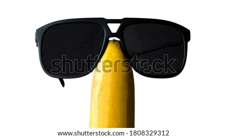 Funny banana in glasses,isolated on white background.
