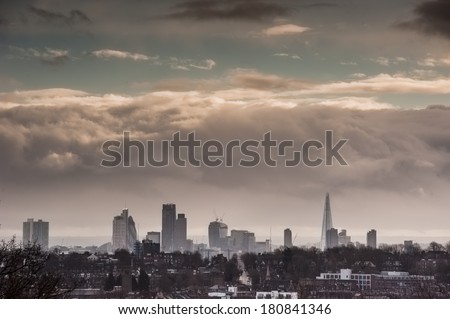 London skyline under dramatic dark clouds