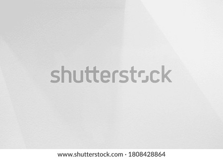 White Concrete Wall with Light Beam and Shadow on the Surface.