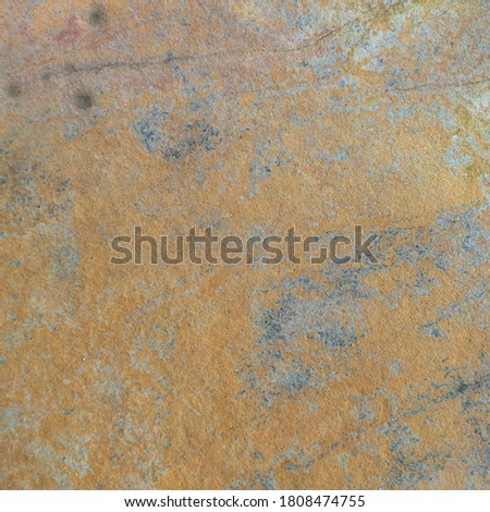 granite stone background with smooth and rusty surface on the beach