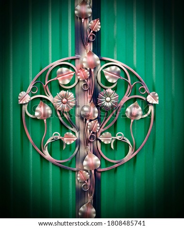 Floral ornament on wrought cast iron fence