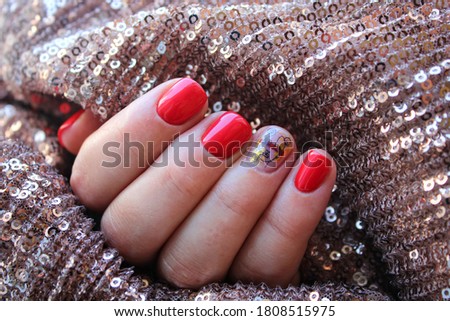 Nail Polish. Art Manicure. Modern style red Nail Polish. Stylish trendy female manicure. Beautiful young woman's hands.