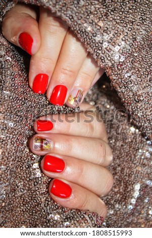 Nail Polish. Art Manicure. Modern style red Nail Polish. Stylish trendy female manicure. Beautiful young woman's hands.