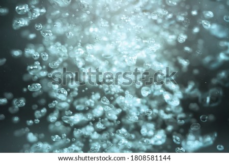 blur bubbles light blue in water , Bokeh pastel tones background