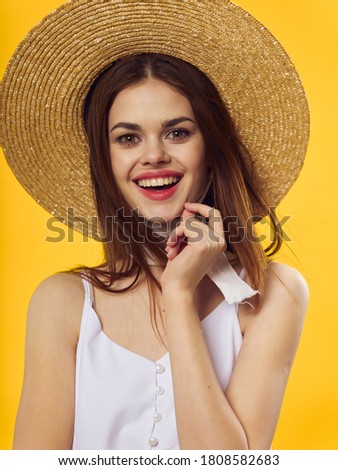 Woman with hat smile elegant style yellow background