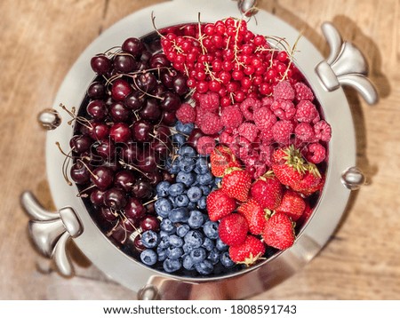 Great best plate with multicolor berries for tasty eating at summer and good mood all year