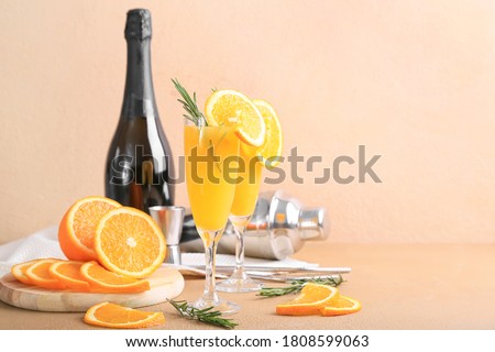 Composition with tasty mimosa cocktails on table Royalty-Free Stock Photo #1808599063