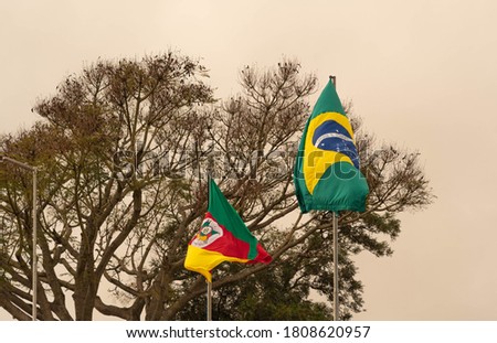 Flags of Brazil and the Brazilian State of Rio Grande do Sul. The flag is classically defined as being the visual symbol representative of a sovereign state, country, state, municipality.