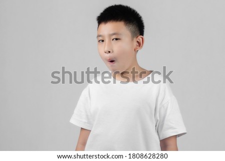Asian boys studio portrait on gray background