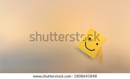 A smile on sticky paper. On a white background.