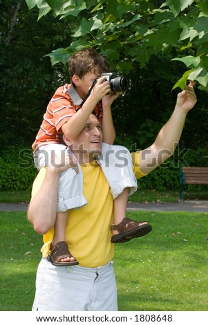 Father and son taking pictures