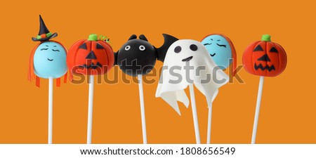 Set of Halloween themed cake pops on orange background. Banner design