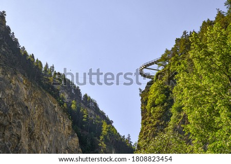Low-angle view of the skybridge suspended above the gorge of Pré-Saint-Didier, a popular tourist resort in the Italian Alps, Aosta Valley, Italy Royalty-Free Stock Photo #1808823454