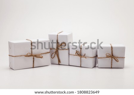 Parcels in white wrapping paper group isolated