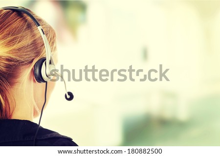 Young beautiful call center worker  Royalty-Free Stock Photo #180882500