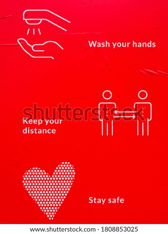 Instructions for protection against covid-19 on a red poster