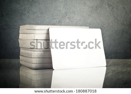 Stack of blank horizontal business cards propped up another with copy space