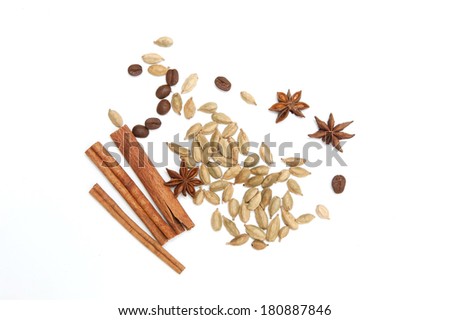 Cardamom, star anise, cinnamon and coffee beans on white background Royalty-Free Stock Photo #180887846
