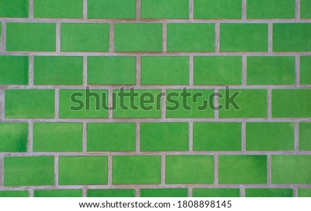 Texture of old tiled wall in green color. For pattern, texture and background