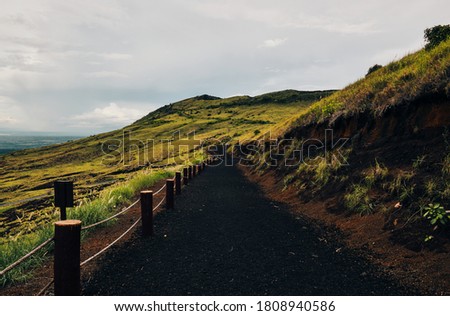 A wide shot of path from the top of Masaya volcano covered by volcanic sand
