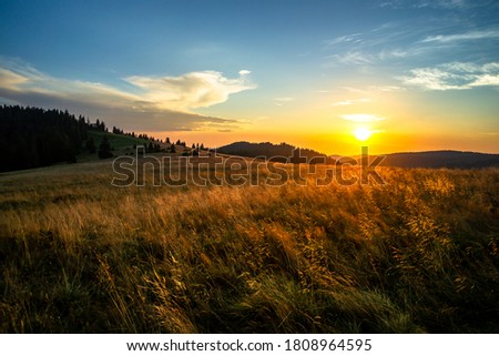 Gorce mountains, view from Turbacz forehead meadow on rising sun Royalty-Free Stock Photo #1808964595