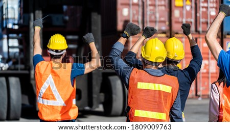 Strike of workers in container yard. Group of multiethnic engineer people during a protest in workplace Royalty-Free Stock Photo #1809009763