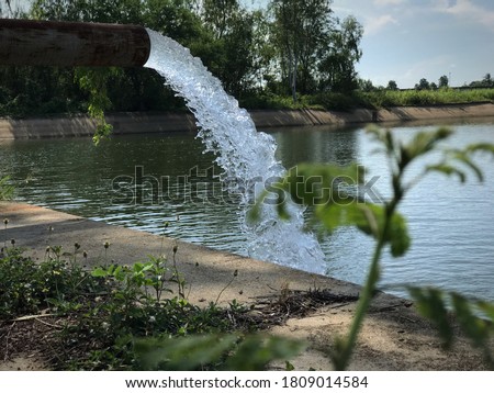 Is a stream from an artesian well to a well Royalty-Free Stock Photo #1809014584