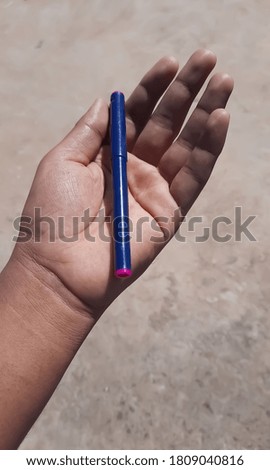 young man had a pen in his left hand