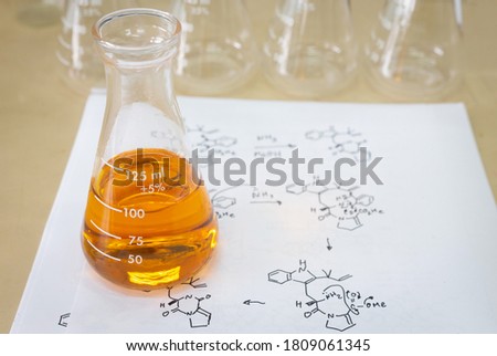 Sample in Erlenmeyer flask with reaction mechanism in concept of biotechnology research and green chemistry. 