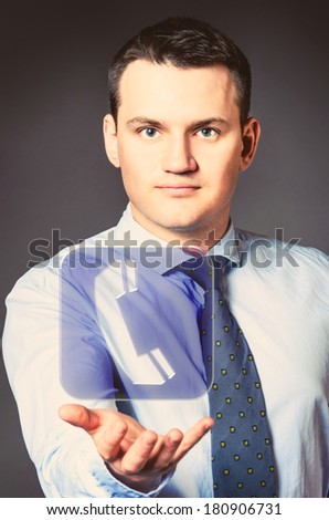 caucasian businessman is holding phone icon in hands