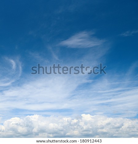white fluffy clouds in the blue sky                                    