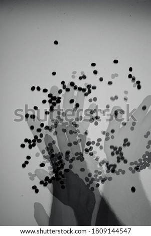 Black and white photo with an abstract image of coffee beans