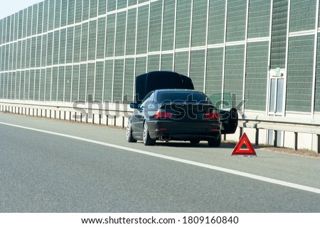 car on the emergency lane, breakdown on the highway. Faulty car  on emergency stopping lane on the roadside. Problem with vehicle Royalty-Free Stock Photo #1809160840