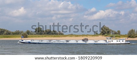 Inland motor tanker sailing he river Waal near Nijmegen in the Netherlands